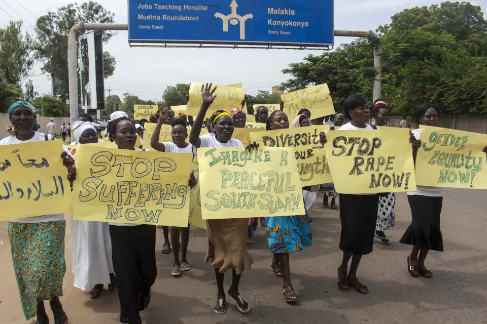 Women march carrying placards with messages demanding peace and their rights, on the streets of South Sudan's capital, Juba on July 13, 2018, following alledged ruthless and brutal attacks on civilians in South Sudan by government forces and their allies that may amount to war crimes, the UN says. A ceasefire agreement signed at the end of June 2018, by South Sudanese President Salva Kiir and opposition leader Riek Machar, yet another failed attempt by the international community to end a five year civil war, appears further imperiled by parliament's vote to extend Kiir's term in office until 2021 amid failure to hold elections this year. (Photo by BULLEN CHOL / AFP)
